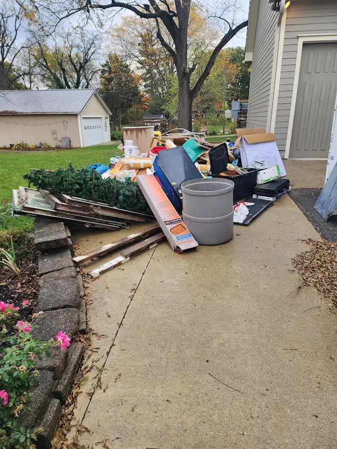 Dumpster being loaded with debris for 30 Yard Dumpster Rental in Lakewood